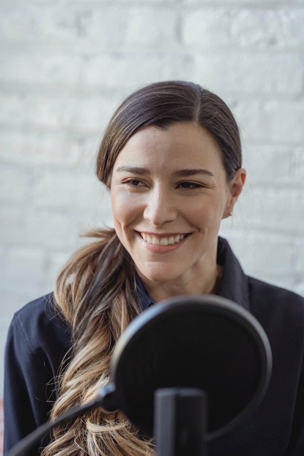 Woman using a microphone to amplify her voice 