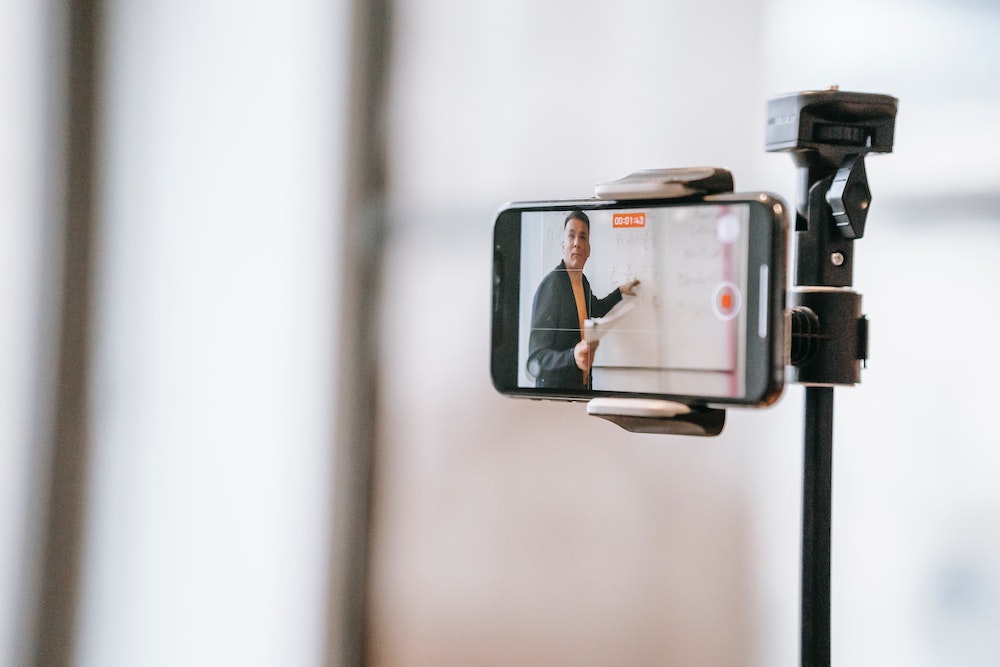 A cell phone camera mounted on a tripod is one way to do a video interview in your home office